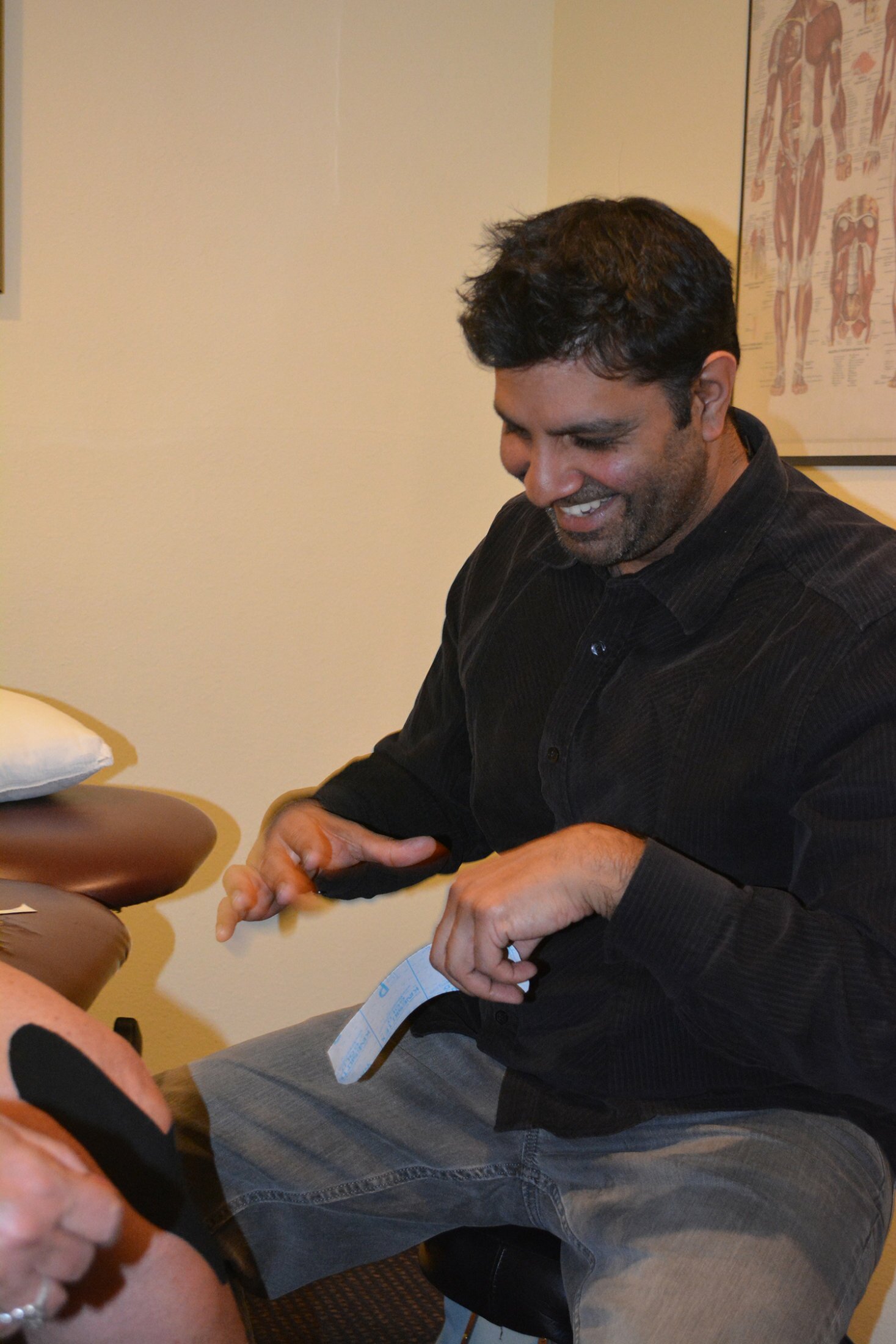 Sanjay describing treatment to a patient